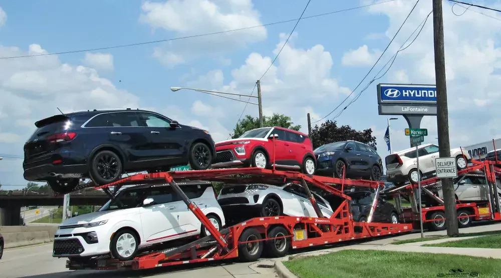 group of cars loaded on a truck