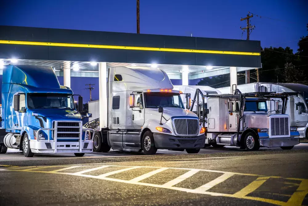 trucks parked in a gas station