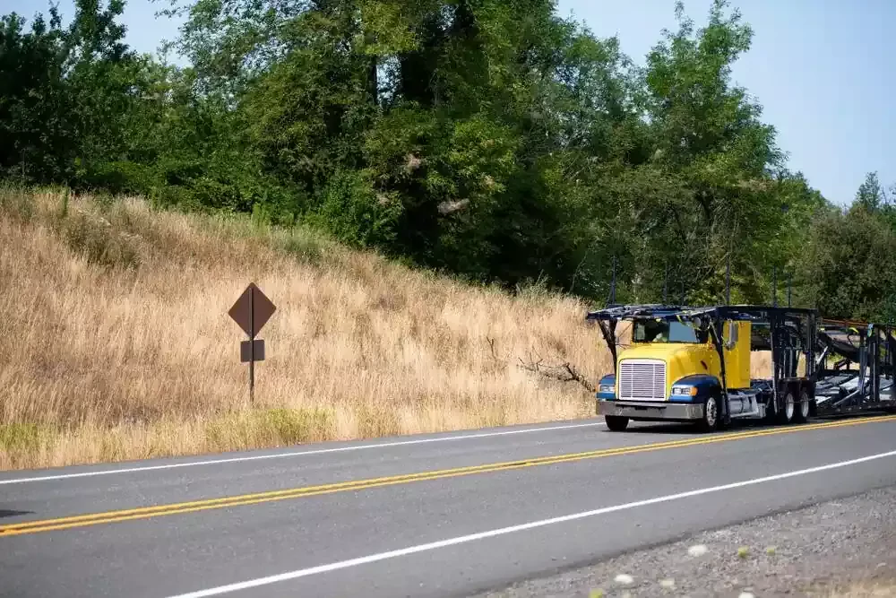 yellow truck on the road