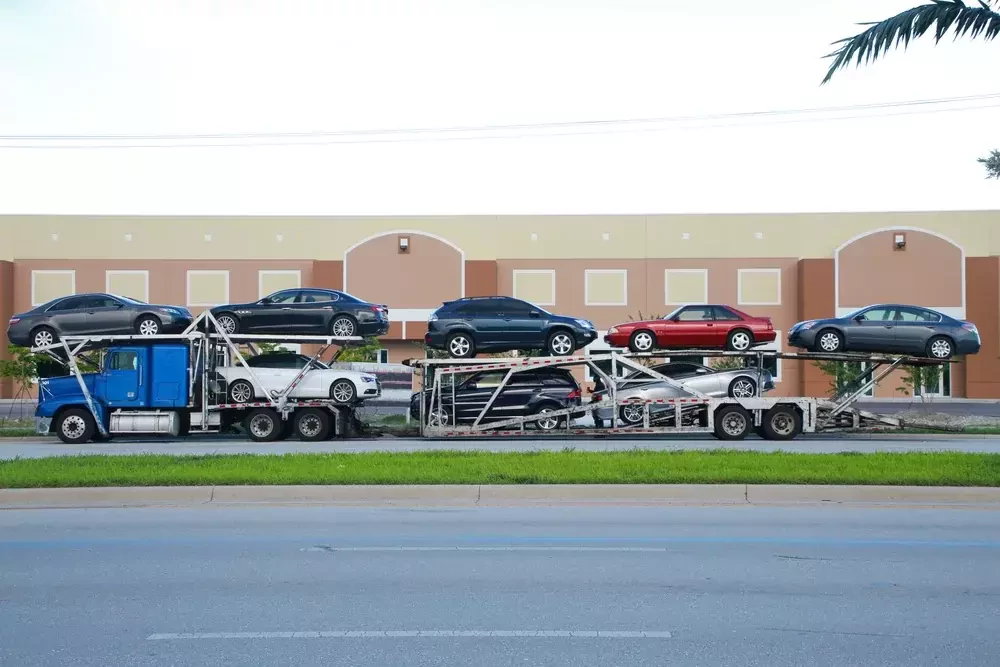 truck carrying eight vehicle