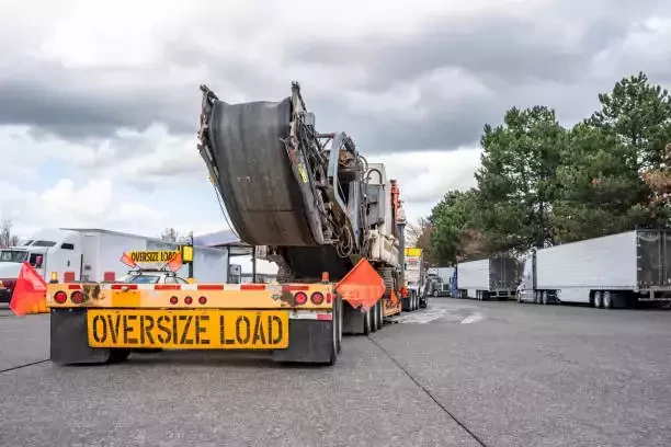 oversize load truck parked in a lot
