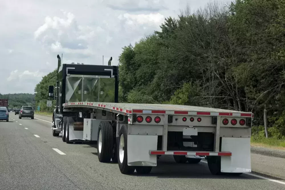 semi truck with a flatbed trailer