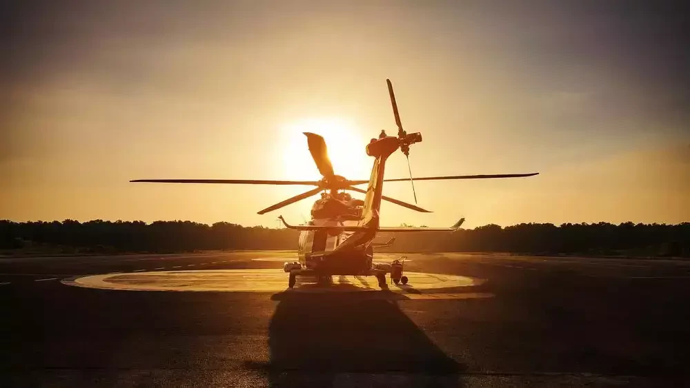 helicopter on the runway at sunset