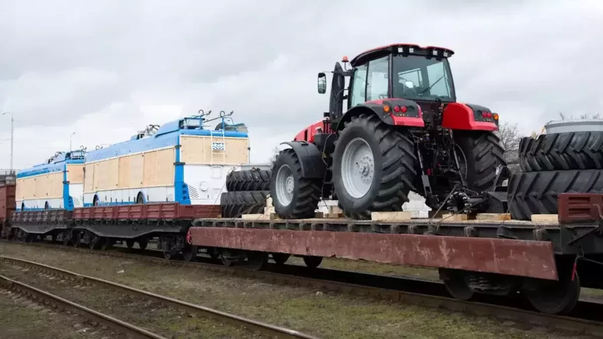 red tractor on train