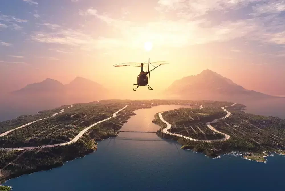 helicopter glides over water and mountains