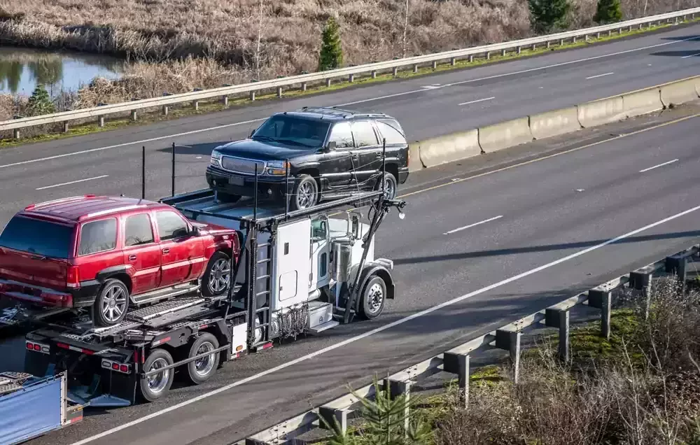 vehicles being transported on a truck