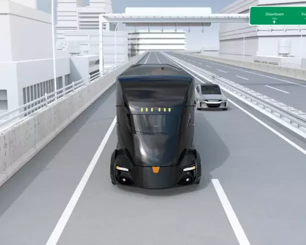 a futuristic bus travels along a modern highway