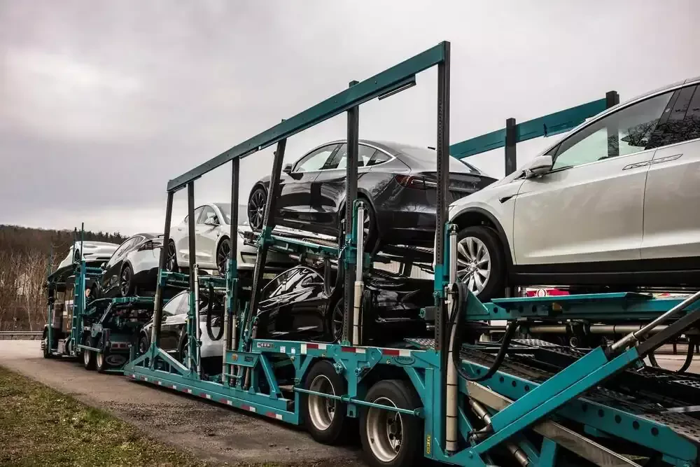 a trailer hauling seven vehicles
