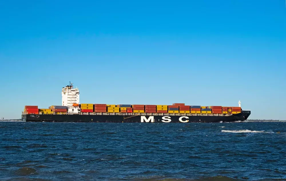 a large maritime vessel moves through the ocean