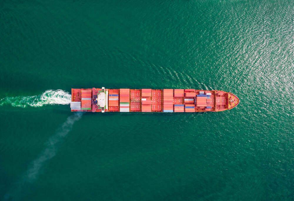 How do shipping containers stay on cargo ships?