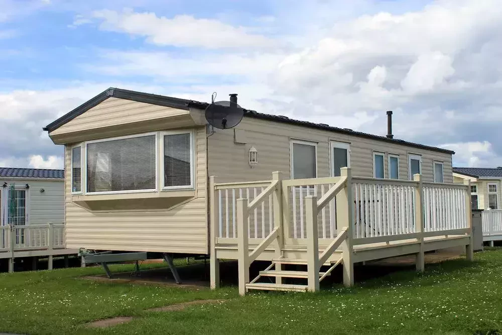 home with a deck and stairs