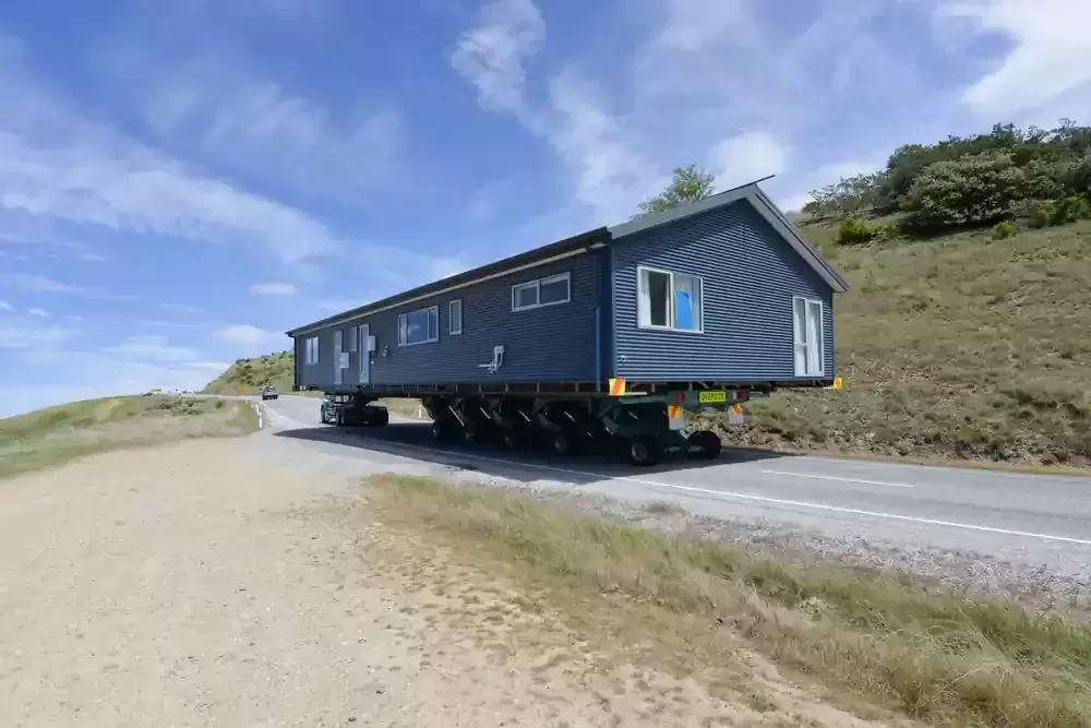 modular home is loaded on a truck
