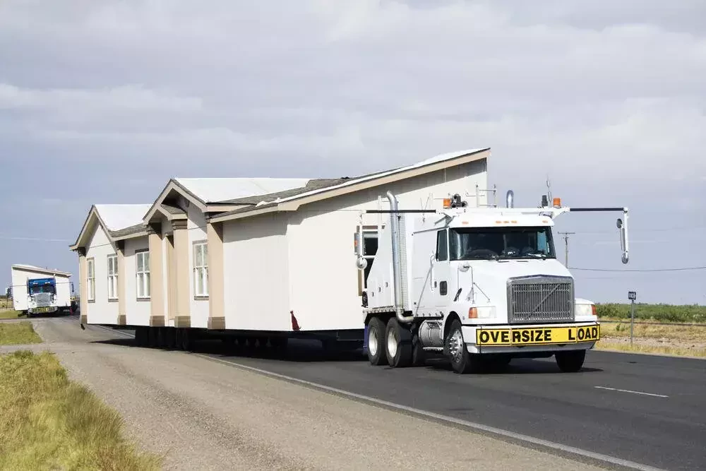 a truck moving a house