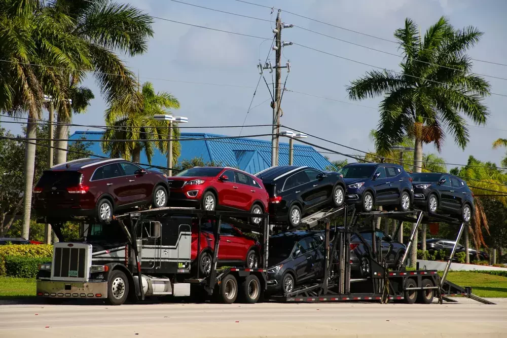 truck carrying the latest models of new vehicles