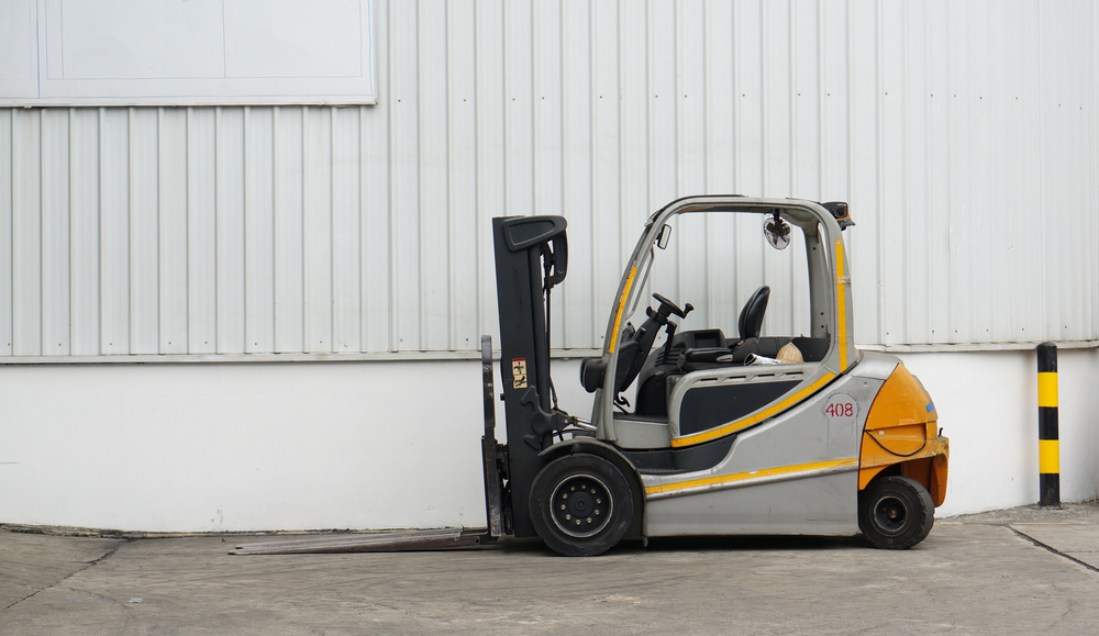 forklift truck parked outside a building