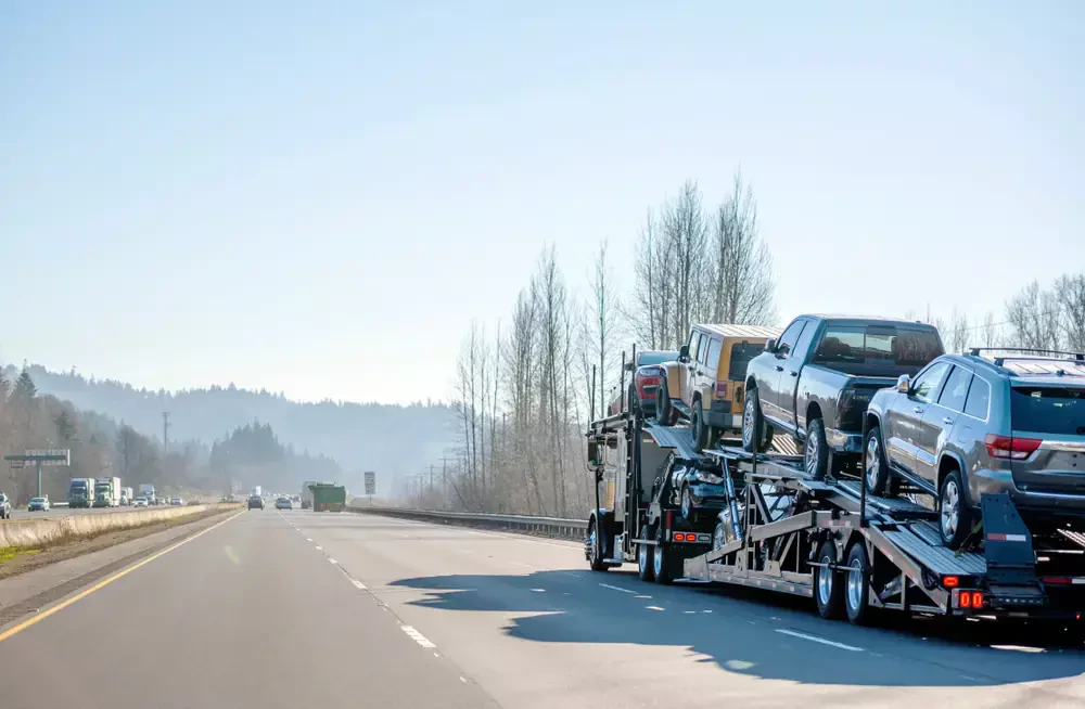 truck transporting multiple vehicles on its flatbed