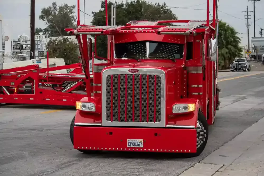 transporting red truck on the road