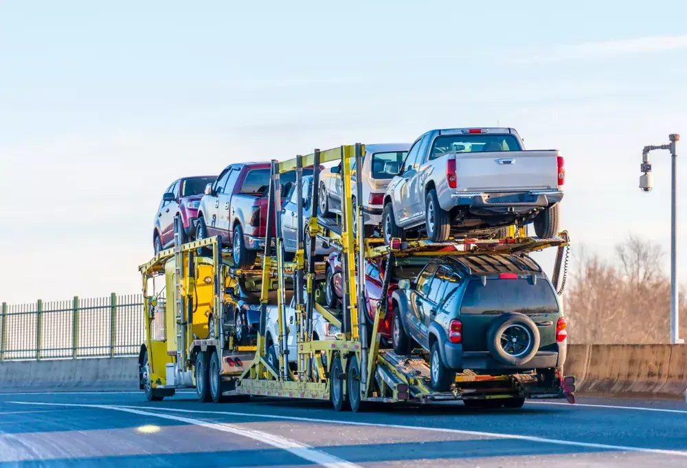 a truck carrying cars on it